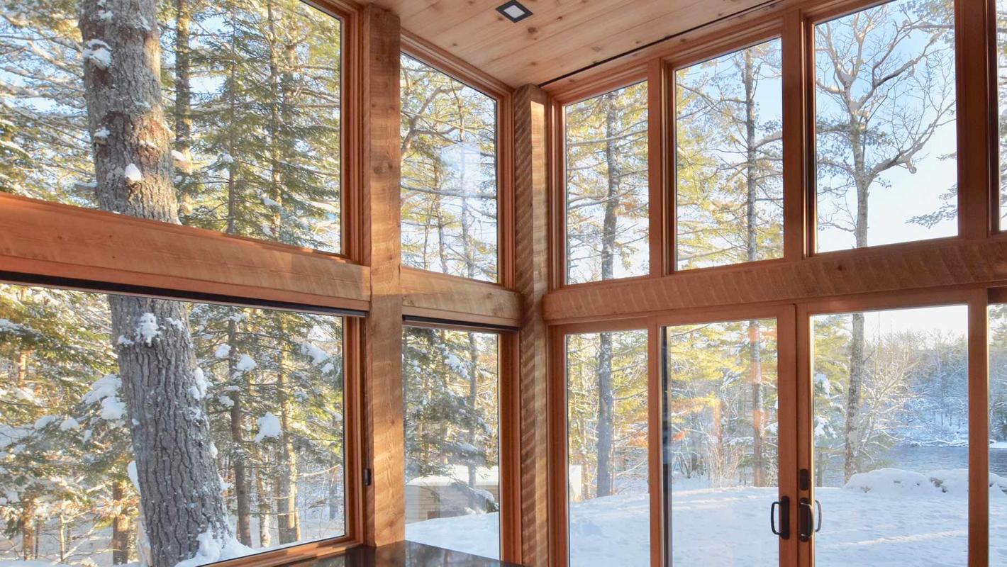 Modern Prefab Timbers. Prefabricated Hemlock Timber Framed Floor to Ceiling Glass Window Wall For a Seamless Transition to Nature